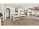 Bright, open kitchen with a large island, white cabinetry, and modern stainless steel appliances at 15633 Panther Lake Dr, Winter Garden, FL 34787