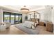 Serene main bedroom with a canopy bed, balcony, and picturesque water views at 15633 Panther Lake Dr, Winter Garden, FL 34787