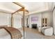 Spacious main bedroom featuring a fireplace, sitting area, and a canopy bed at 15633 Panther Lake Dr, Winter Garden, FL 34787