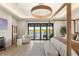 Stunning main bedroom with canopy bed, sitting area, and lake view balcony access at 15633 Panther Lake Dr, Winter Garden, FL 34787