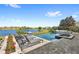 Resort-style pool with a view, lounge chairs, and lush landscaping at 15633 Panther Lake Dr, Winter Garden, FL 34787