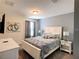Comfortable bedroom featuring a queen bed, stylish décor, and soft, natural light at 1673 Moon Valley Dr, Davenport, FL 33896