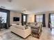 Bright and airy living room featuring modern furniture, a large TV, and stylish decor at 1673 Moon Valley Dr, Davenport, FL 33896