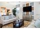 Inviting living room with stylish furniture, modern decor, and large windows at 1673 Moon Valley Dr, Davenport, FL 33896