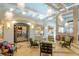 Welcoming lobby area with cozy seating, tasteful decor, and a glimpse of the bar area at 1673 Moon Valley Dr, Davenport, FL 33896