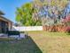 Enjoy the lush backyard with deck and patio under the shade of mature oak trees at 1913 Lazy Oaks Loop, St Cloud, FL 34771