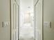 Hallway view into primary bathroom suite with tub and glass shower at 1913 Lazy Oaks Loop, St Cloud, FL 34771