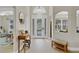 Bright entryway featuring tiled floors, high ceilings, and a decorative front door with sidelights and transom window at 1913 Lazy Oaks Loop, St Cloud, FL 34771