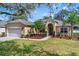 Lovely single-story home with a well-kept lawn and manicured landscaping elements at 1913 Lazy Oaks Loop, St Cloud, FL 34771