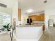 Kitchen with wood cabinets, granite countertops, modern appliances, and lots of natural light at 1913 Lazy Oaks Loop, St Cloud, FL 34771