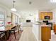 Bright kitchen with stainless steel appliances that opens to a dining area and a comfortable living room at 1913 Lazy Oaks Loop, St Cloud, FL 34771