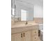 Bathroom featuring a single sink vanity, large mirror, and neutral colors at 1960 Evard Ave, Deltona, FL 32725