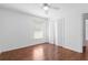 Light and airy bedroom featuring wood flooring and closet at 1960 Evard Ave, Deltona, FL 32725