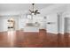 Open concept living room with hardwood floors that leads to a modern kitchen at 1960 Evard Ave, Deltona, FL 32725