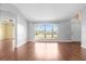 Bright living room with hardwood floors, large window, and neutral paint at 1960 Evard Ave, Deltona, FL 32725