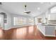 Open concept living room featuring hardwood floors with a breakfast bar at 1960 Evard Ave, Deltona, FL 32725