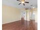 Main bedroom featuring hardwood floors and an ensuite bathroom at 1960 Evard Ave, Deltona, FL 32725