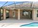 Covered patio area overlooking the pool, featuring brick columns, lighting and decorative string lights at 1960 Evard Ave, Deltona, FL 32725