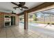 Spacious outdoor patio with brick columns, tile flooring, and a view of the swimming pool at 1960 Evard Ave, Deltona, FL 32725