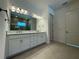 Bathroom featuring double sinks, vanity, and large mirror at 2010 Divot Dr, Daytona Beach, FL 32124