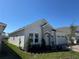 Charming single-story home featuring a stone facade, a paver driveway, and a three-car garage at 2010 Divot Dr, Daytona Beach, FL 32124