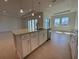 Spacious kitchen island with stainless steel appliances and pendant lighting at 2010 Divot Dr, Daytona Beach, FL 32124