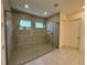 Modern bathroom featuring a spacious glass-enclosed shower with tile and a built-in bench at 2013 Divot Dr, Daytona Beach, FL 32124