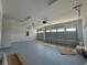 Spacious two car garage with gray floor, white walls, and garage door openers at 2013 Divot Dr, Daytona Beach, FL 32124
