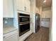 Kitchen with stainless steel microwave/oven combo and stainless steel refrigerator at 2013 Divot Dr, Daytona Beach, FL 32124