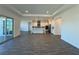 Open concept living space with tile flooring and a view of the white kitchen island at 2013 Divot Dr, Daytona Beach, FL 32124