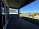 Covered patio offering views of the lake and a beautiful backyard at 2013 Divot Dr, Daytona Beach, FL 32124
