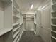 Spacious walk-in closet offering ample storage with shelves, rods, and drawers at 2013 Divot Dr, Daytona Beach, FL 32124