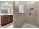 Tiled shower featuring a built-in niche and glass partition at 2398 Nuthatch St, St Cloud, FL 34771