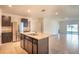Modern kitchen with stainless steel appliances, granite countertops, and ample cabinet space at 2464 Ribbon Fall Ave, Davenport, FL 33837