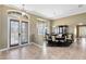 Elegant dining room featuring a spacious layout, stylish chandelier, and ample natural light at 25249 Derby Dr, Sorrento, FL 32776