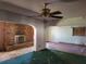 Open concept living room featuring a brick fireplace at 2652 Ravenall Ave, Orlando, FL 32811