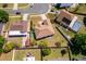 Aerial view of a residential property featuring a well-maintained roof and landscaping in a suburban neighborhood at 2712 Pearl Court, Kissimmee, FL 34743