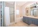 Bright bathroom featuring a shower, garden tub, and double sink vanity for a spa-like experience at 2712 Pearl Court, Kissimmee, FL 34743