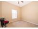 Neutral bedroom with a ceiling fan, window with blinds, and space for furniture, offering a blank canvas at 2712 Pearl Court, Kissimmee, FL 34743