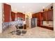Modern kitchen features granite countertops, stainless steel appliances, and ample cabinet space for storage at 2712 Pearl Court, Kissimmee, FL 34743