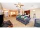 Spacious living room features neutral carpeting and seamlessly transitions into the dining area and kitchen at 2712 Pearl Court, Kissimmee, FL 34743