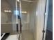 Glass enclosed shower with tile walls at 2861 Willowseed Ln, St Cloud, FL 34772