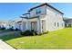 Inviting two-story home showcases well-maintained landscaping and a welcoming front entrance at 2861 Willowseed Ln, St Cloud, FL 34772