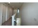 Second floor hallway with neutral carpet at 2861 Willowseed Ln, St Cloud, FL 34772