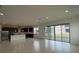 Open floor plan with tile floors and big sliding doors leading to outdoor space at 2861 Willowseed Ln, St Cloud, FL 34772