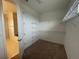Walk-in closet with wire shelving at 2861 Willowseed Ln, St Cloud, FL 34772