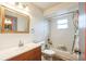 Bathroom with a tub and shower combination, vanity with mirror, and ceramic tile at 2935 Apaloosa Trl, Deltona, FL 32738
