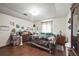 Cozy bedroom featuring wood floors and warm decor at 2935 Apaloosa Trl, Deltona, FL 32738