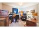 Cozy bedroom featuring a comfortable recliner, desk, and ample space at 2935 Apaloosa Trl, Deltona, FL 32738