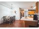 Inviting dining area with wood floors adjacent to the kitchen at 2935 Apaloosa Trl, Deltona, FL 32738
